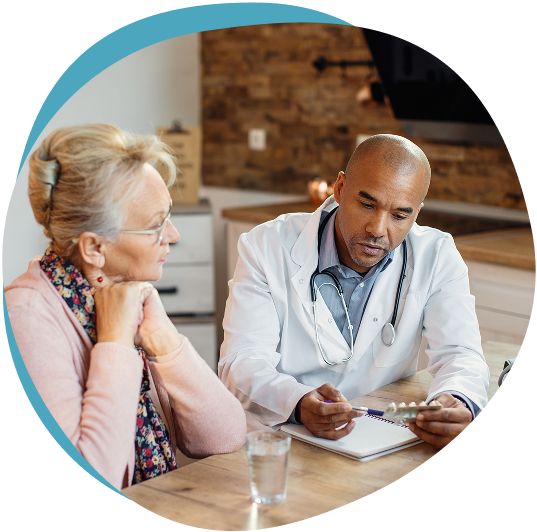 Doctor discussing treatment with an older female patient